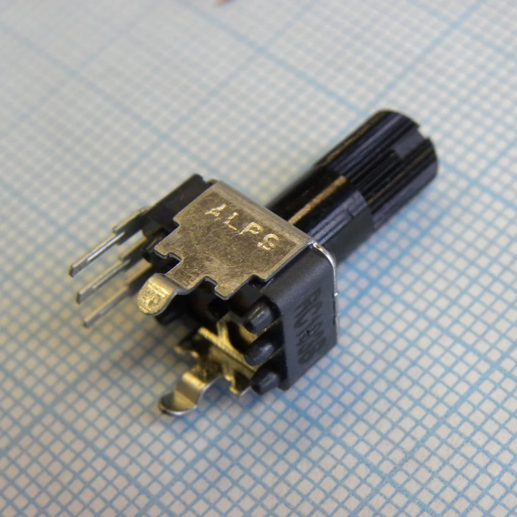 RK09K113004U - Singl-unit, Vertical, Flat shift 15mm, With detent, 10K, 1B